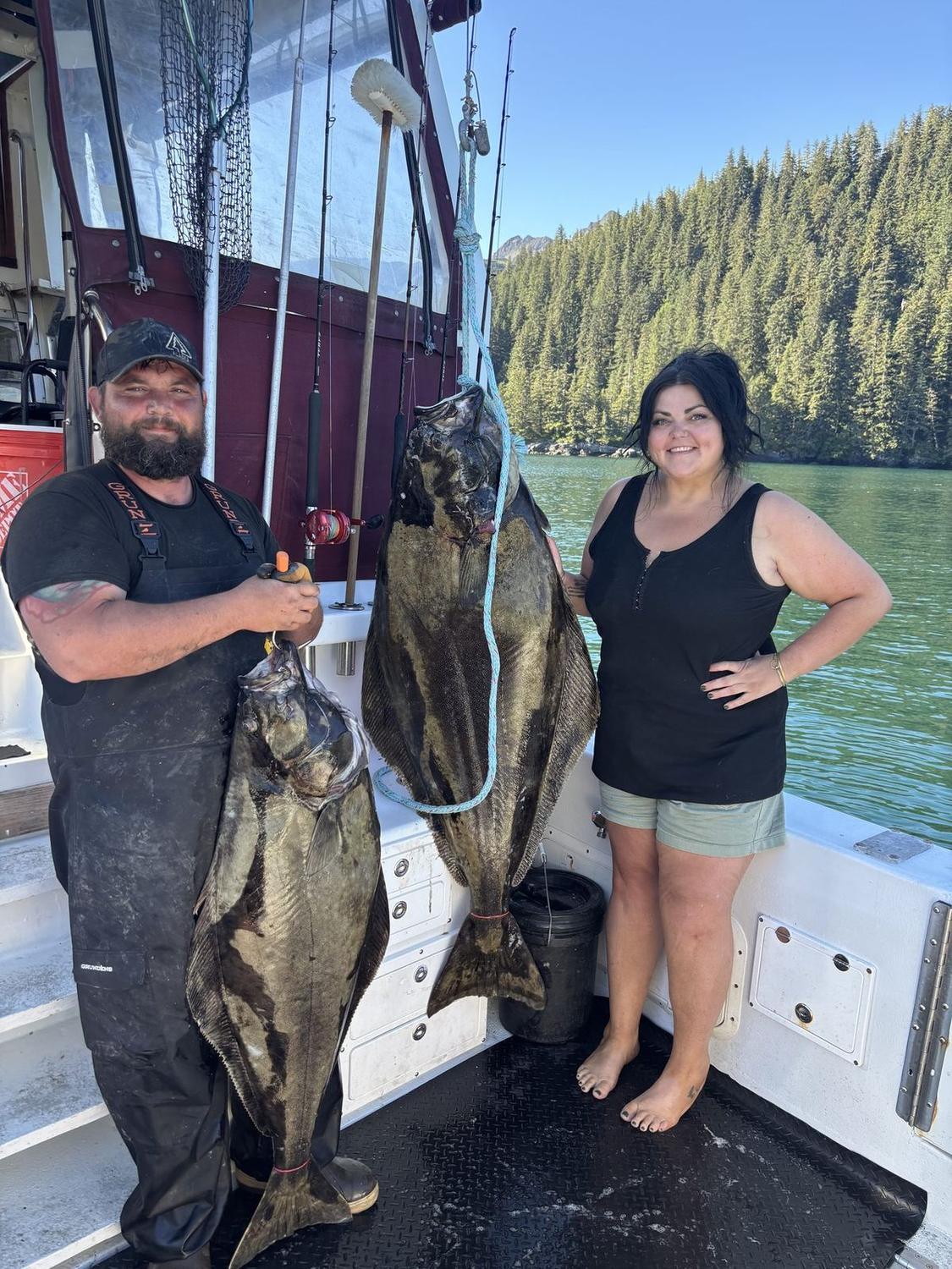 Guests with their halibut catch aboard Swoboda Charters